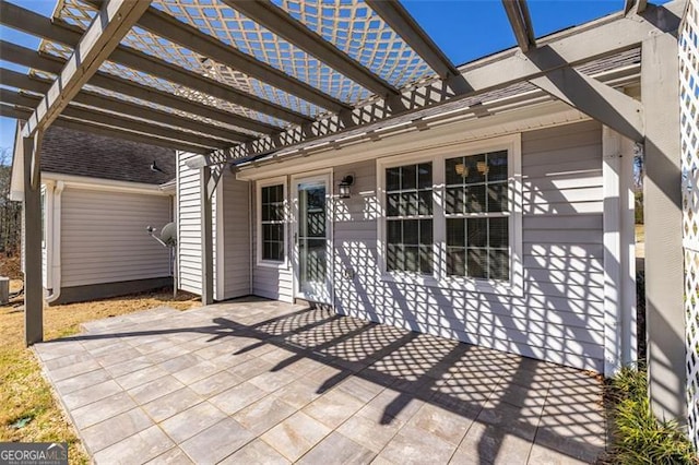 view of patio / terrace featuring central air condition unit and a pergola