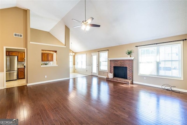 unfurnished living room featuring a fireplace, visible vents, light wood-style flooring, ceiling fan, and baseboards