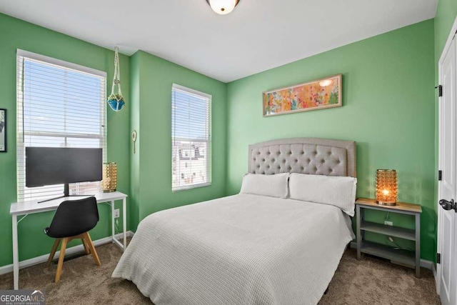 carpeted bedroom with baseboards