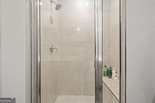 bathroom featuring a shower stall