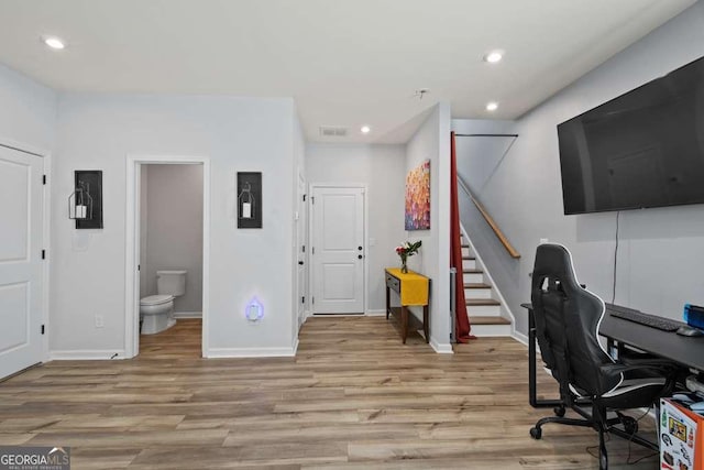 office featuring recessed lighting, baseboards, visible vents, and light wood finished floors