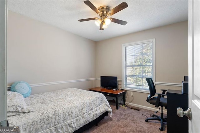 bedroom with carpet, ceiling fan, a textured ceiling, and baseboards