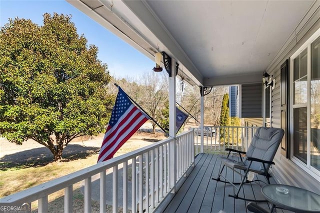 wooden deck featuring a porch