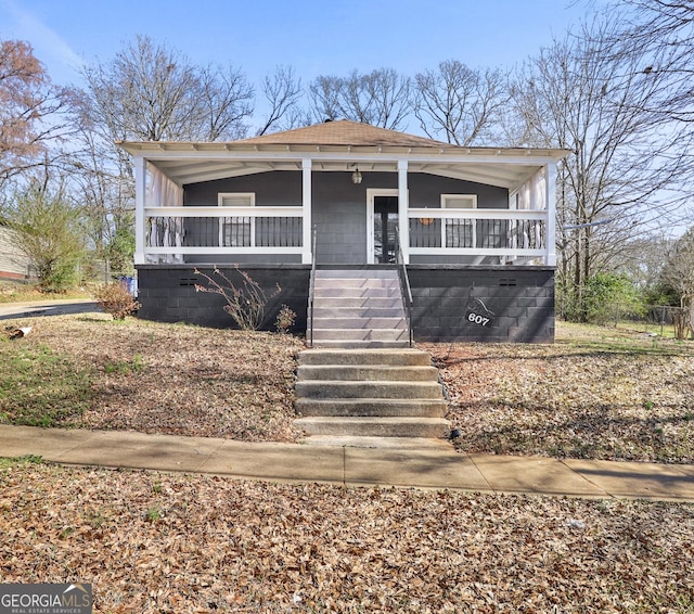 view of front of house featuring a porch and stairway