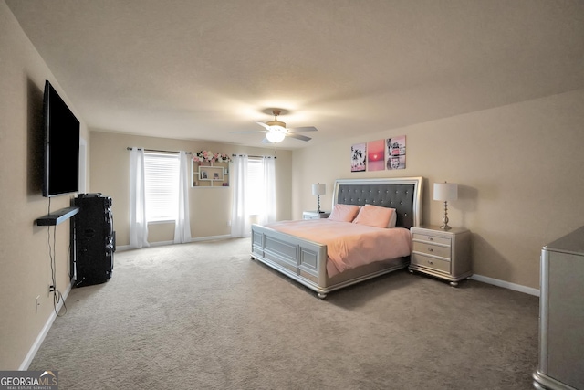 bedroom featuring light carpet, ceiling fan, and baseboards