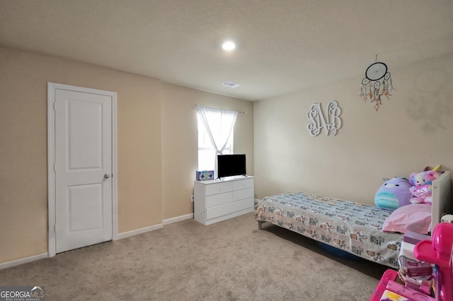 bedroom with light carpet, baseboards, and visible vents