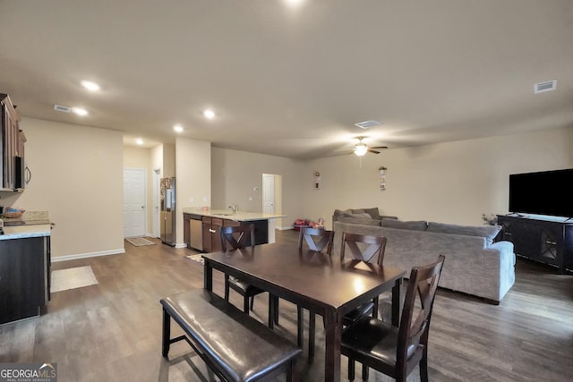 dining room featuring a ceiling fan, recessed lighting, visible vents, and wood finished floors