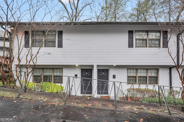 view of front of house with brick siding