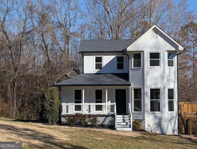 view of front of house featuring a porch and a front yard