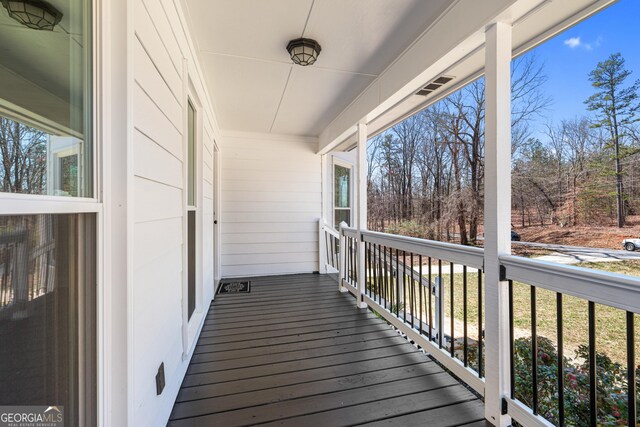 view of front of property with covered porch and a front lawn