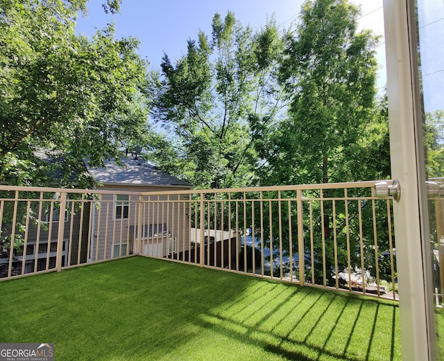 view of yard featuring a balcony