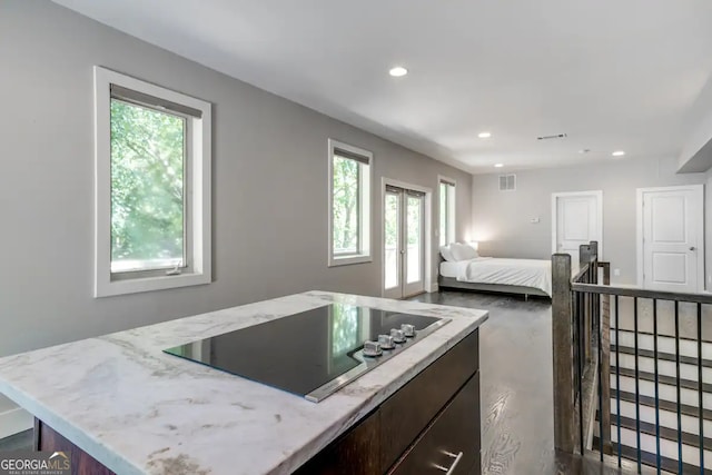 bedroom featuring recessed lighting, visible vents, and french doors