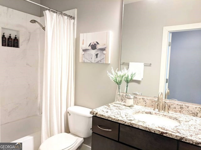 bathroom featuring toilet, shower / tub combo with curtain, and vanity