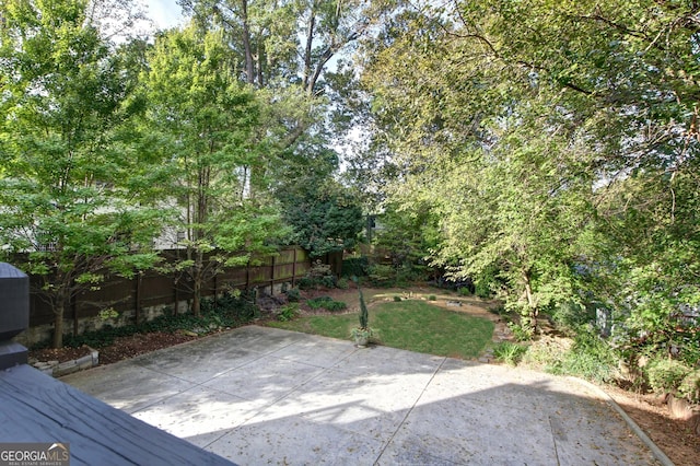 view of yard featuring a patio area and fence