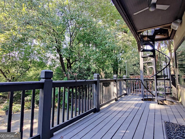 wooden terrace featuring a ceiling fan