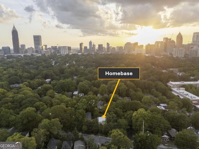 aerial view at dusk featuring a view of city