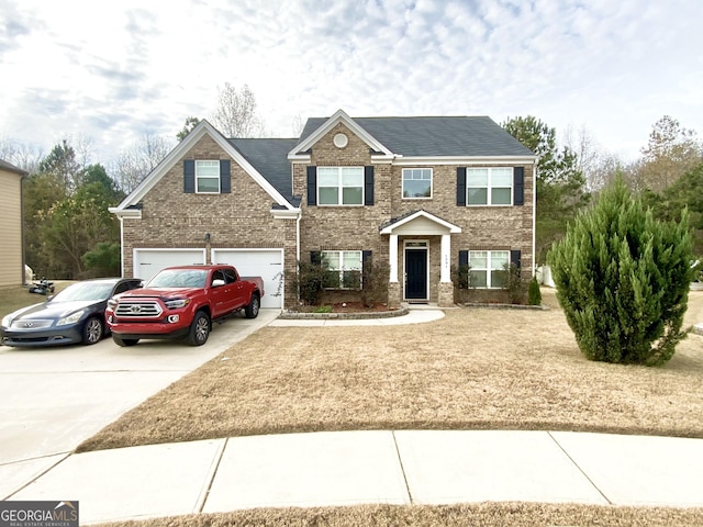 view of front of property featuring driveway and brick siding