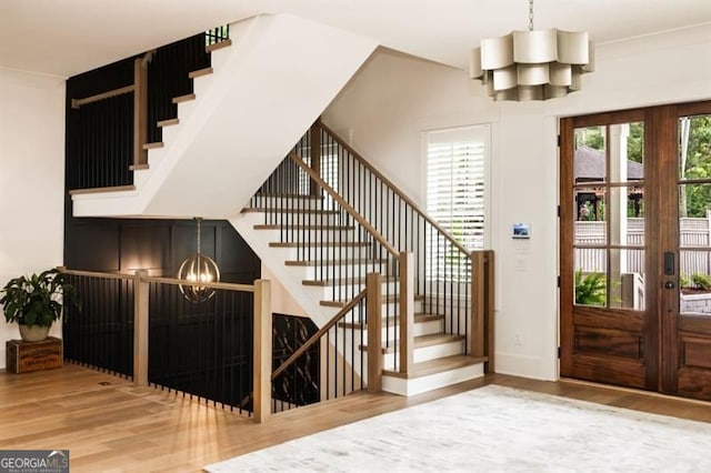 9370 Raldon Rd, Gainesville, GA 30506 - entryway with a chandelier, wood finished floors, stairs, and french doors