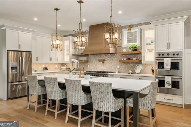 9370 Raldon Rd, Gainesville, GA 30506 - kitchen featuring stainless steel appliances, light countertops, white cabinetry, extractor fan, and recessed lighting