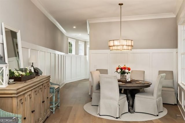 9370 Raldon Rd, Gainesville, GA 30506 - dining area featuring a decorative wall, ornamental molding, wood finished floors, and wainscoting