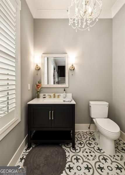 9370 Raldon Rd, Gainesville, GA 30506 - half bathroom with a chandelier and vanity
