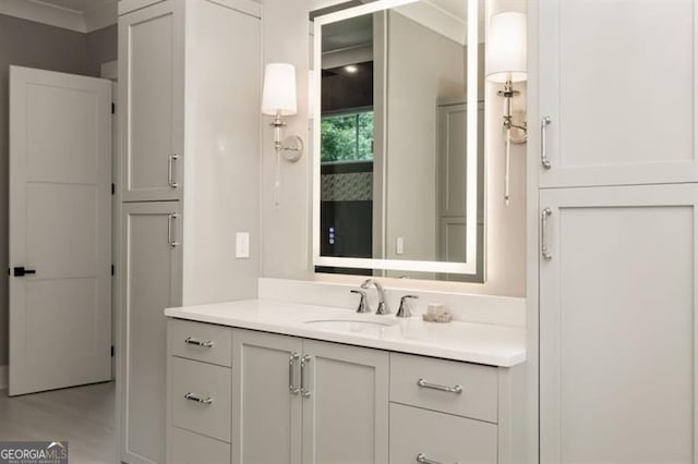 9370 Raldon Rd, Gainesville, GA 30506 - bathroom with vanity, wood finished floors, and crown molding