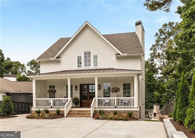 9370 Raldon Rd, Gainesville, GA 30506 - view of front of property featuring covered porch, a standing seam roof, roof with shingles, and a chimney
