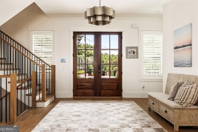9370 Raldon Rd, Gainesville, GA 30506 - foyer entrance featuring a chandelier, french doors, wood finished floors, ornamental molding, and stairway