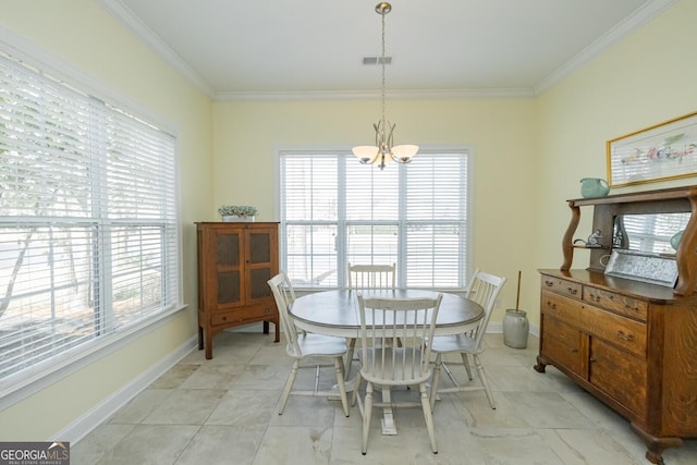 dining room featuring a chandelier, a wealth of natural light, and crown molding