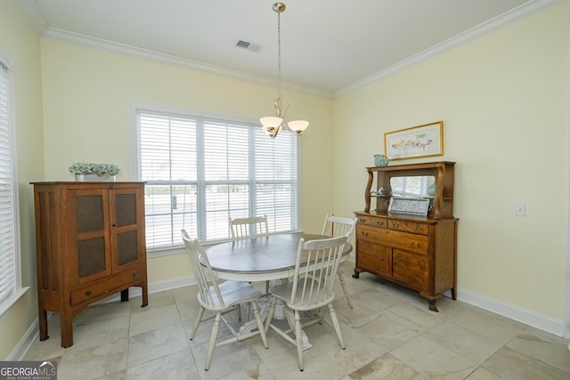 dining area featuring an inviting chandelier, baseboards, visible vents, and crown molding