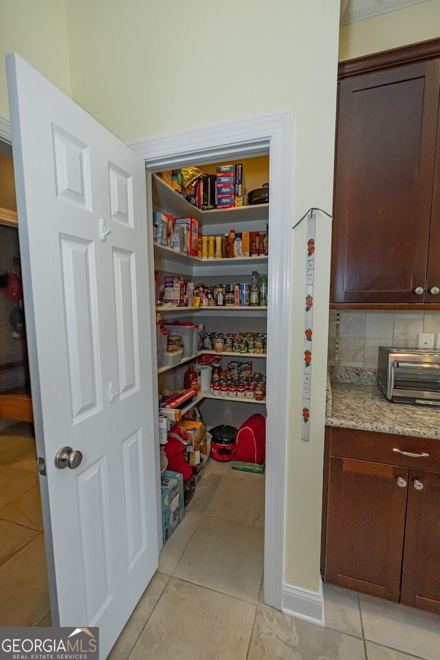 storage area featuring a toaster