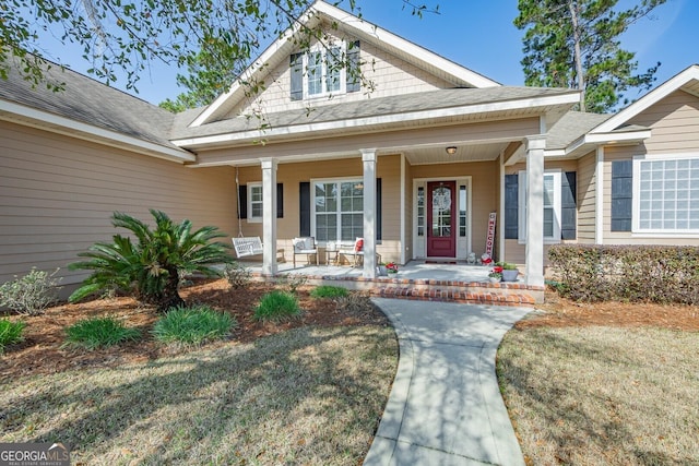 property entrance featuring a porch