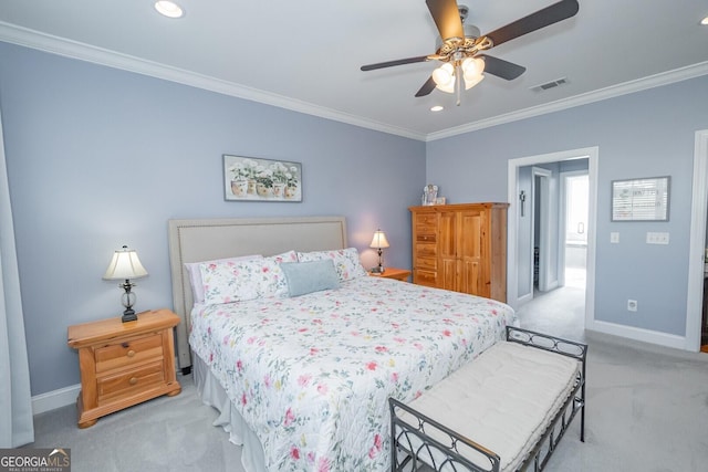 carpeted bedroom with baseboards, visible vents, and ornamental molding