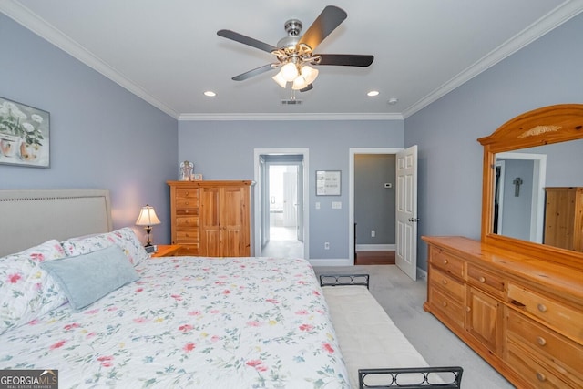 bedroom featuring a ceiling fan, baseboards, crown molding, and light colored carpet