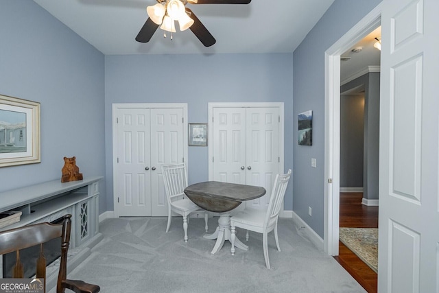 dining room featuring ceiling fan, carpet floors, and baseboards