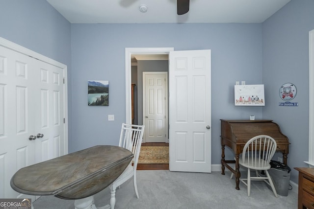 office space with carpet floors and ceiling fan