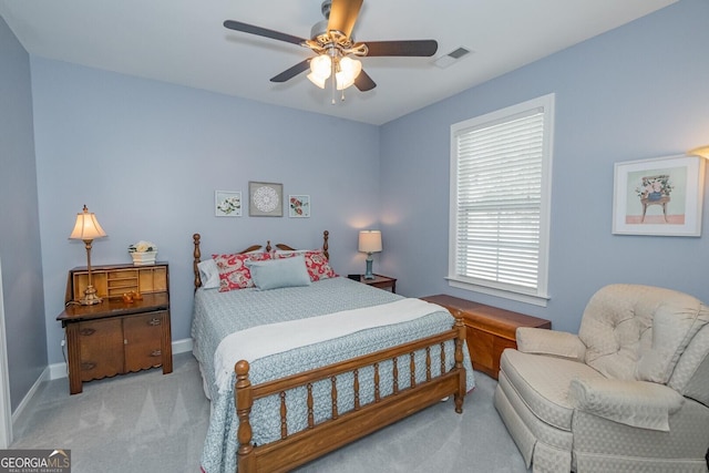 bedroom featuring baseboards, carpet, visible vents, and a ceiling fan