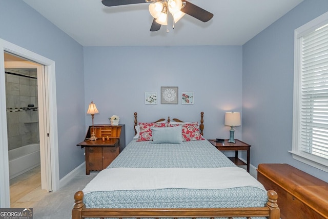 bedroom featuring a ceiling fan and baseboards