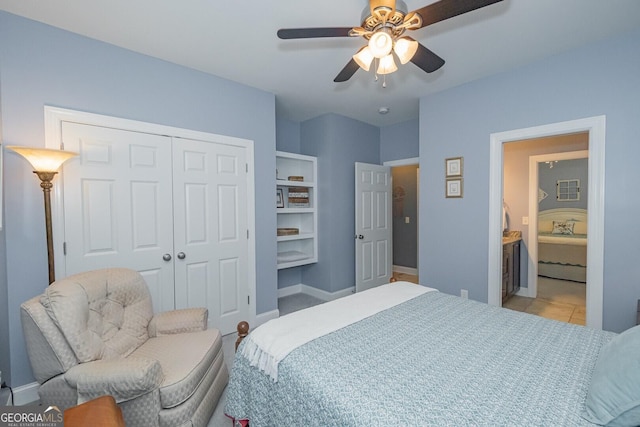 bedroom featuring a closet, ceiling fan, baseboards, and light tile patterned floors