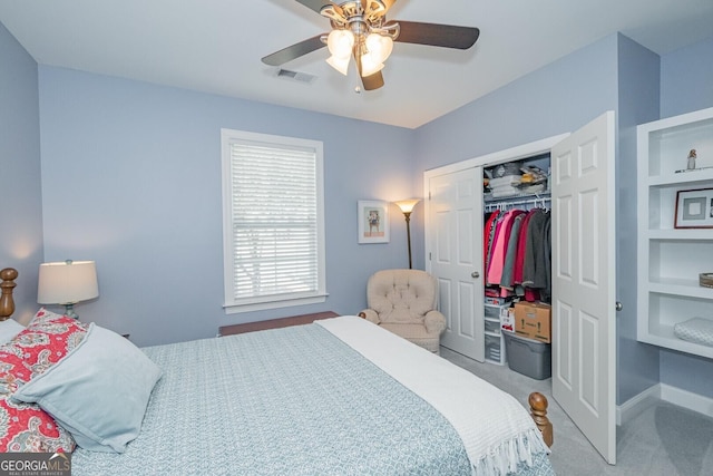 bedroom with carpet, visible vents, ceiling fan, and a closet