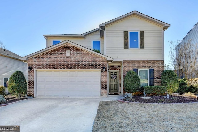 traditional-style house featuring an attached garage, concrete driveway, and brick siding