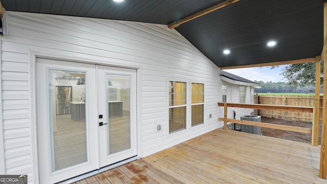 deck featuring central AC, french doors, and fence