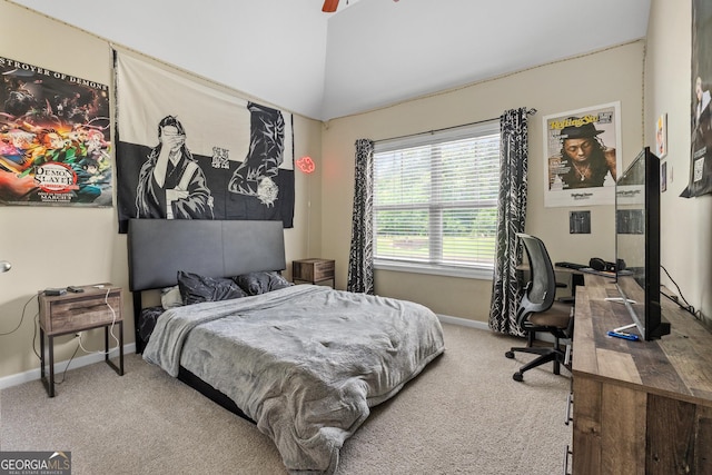 bedroom with lofted ceiling, carpet, baseboards, and a ceiling fan