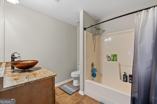 bathroom with tile patterned flooring, toilet, vanity, baseboards, and shower / bath combo with shower curtain