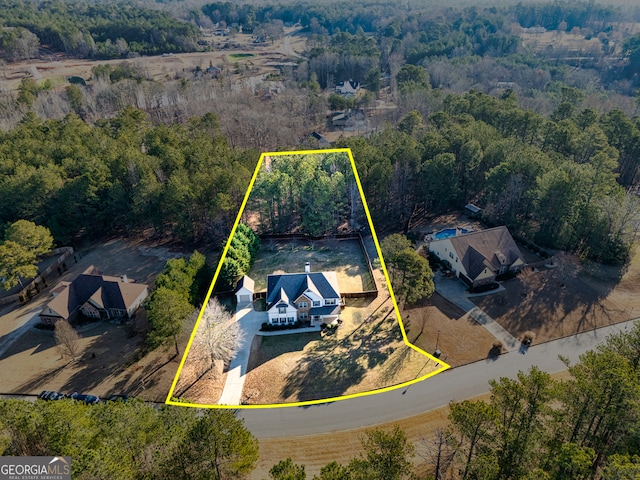 drone / aerial view with a forest view