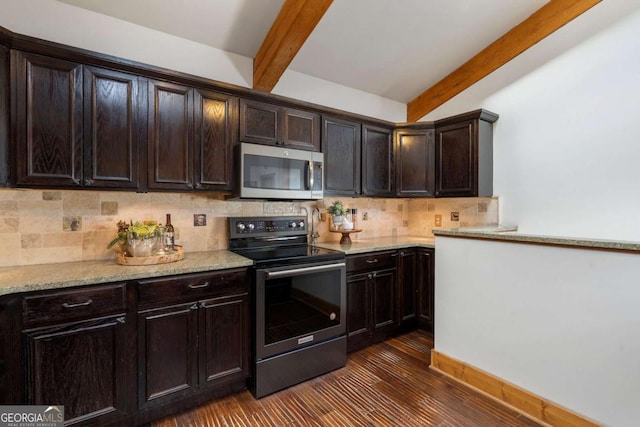 kitchen with range with electric cooktop, dark wood-style flooring, stainless steel microwave, and beamed ceiling