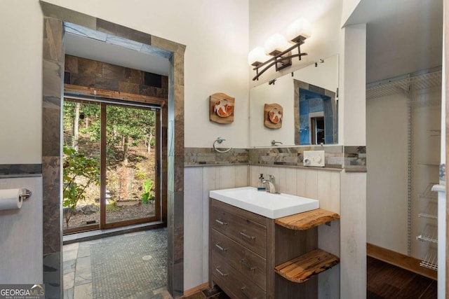 bathroom with wainscoting and vanity