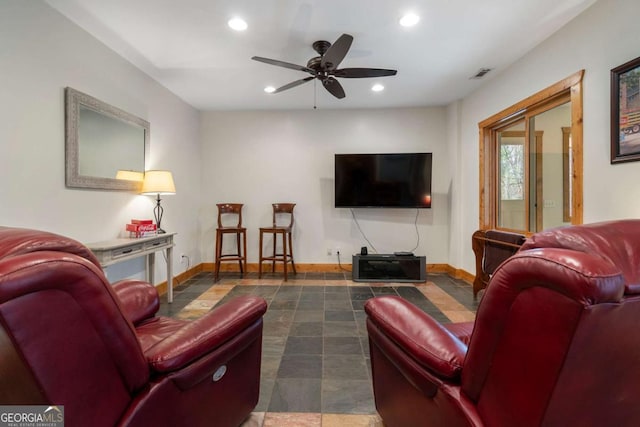 living area featuring baseboards, visible vents, a ceiling fan, and recessed lighting