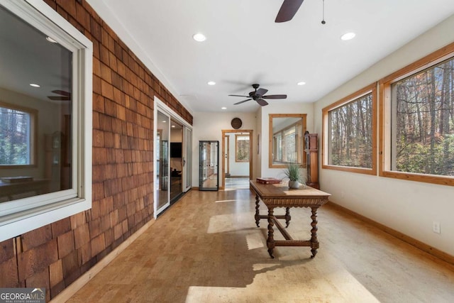 interior space featuring baseboards and recessed lighting