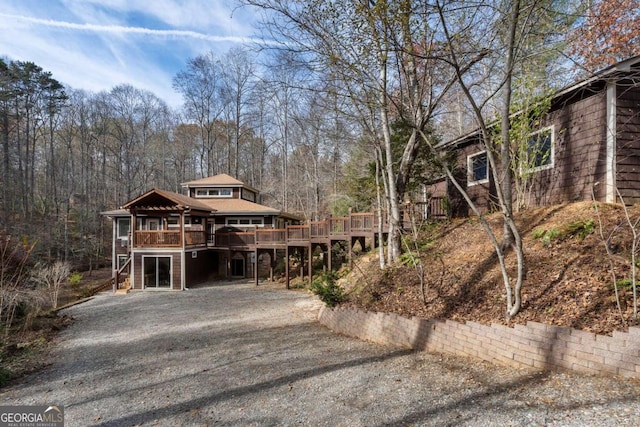 view of front of home featuring a wooden deck